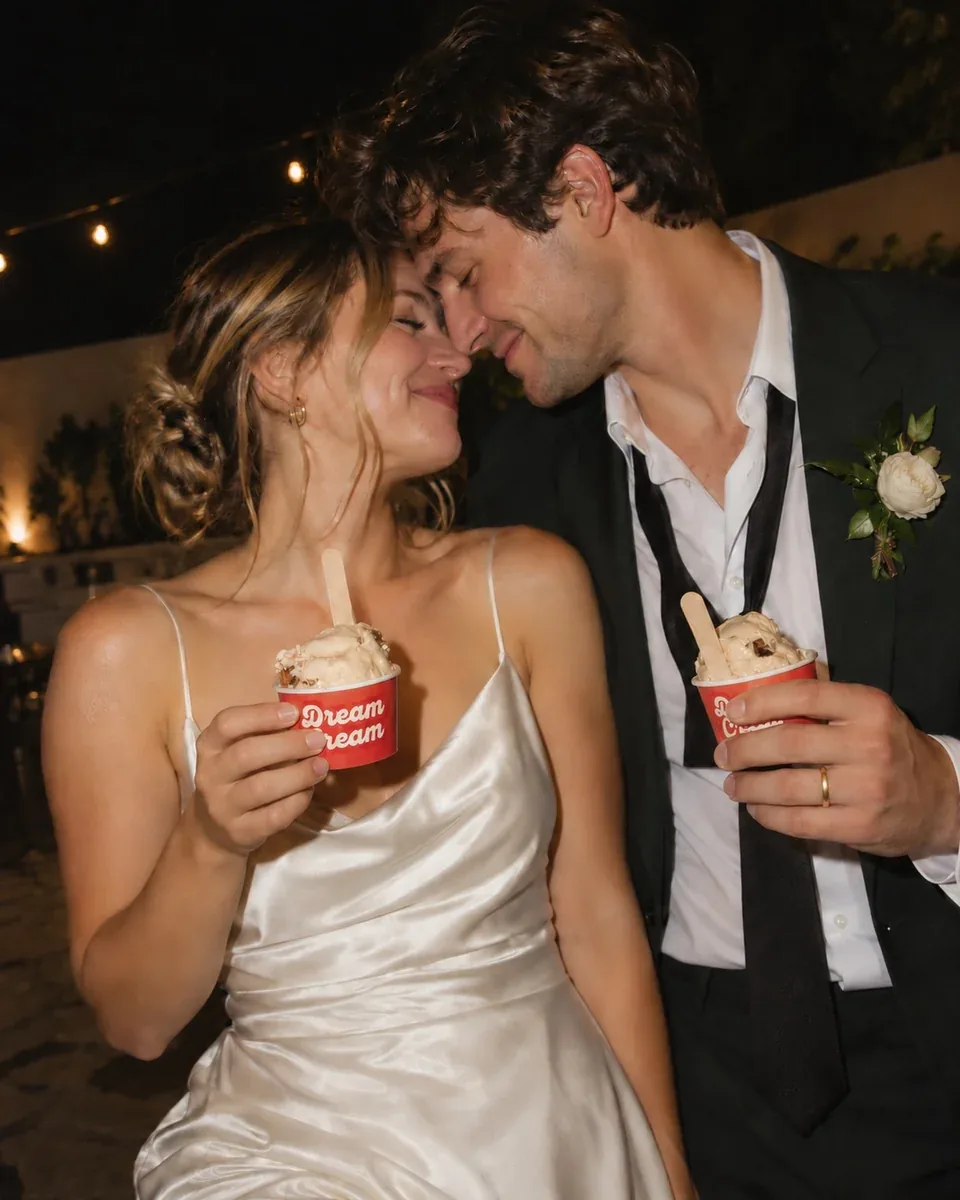 Wedding inspiration: a couple holding red Dream Cream gelato cups